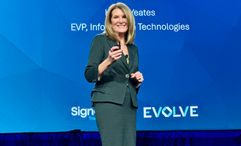 Karen Yeates, Signature Travel Network’s executive vice president of information technologies, on stage Signature's annual conference.