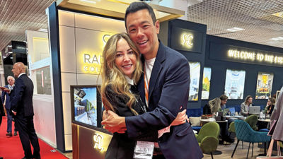 Luxury travel advisor Stacy King hugs Access Italy’s Simone Amorico at the International Luxury Travel Market.