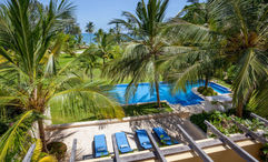 The pool at Tribe Beach House in Kilifi, set among palm trees on Kenya’s unspoiled coast.