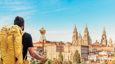 A pilgrim reaches the end of his journey to Camino de Santiago in Santiago de Compostela, Spain.
